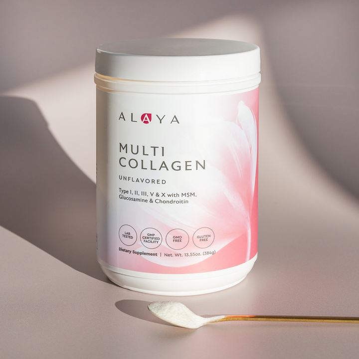 Alaya Multi Collagen Unflavored Powder supplement bottle on a dusty pink background with a gold spoon and powder 